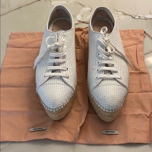 Miu Miu white leather wedge sneakers.